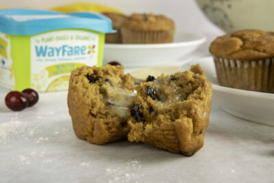 Pumpkin Cranberry Muffins cut in half and spread with WayFare Dairy Free Butter Salted & Whipped.